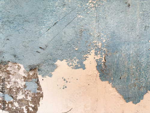 Distressed Wall Textured blue paint peeling revealing aged concrete, vintage style background