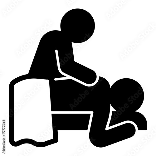 Masseur and man with towel solid icon, spa massage concept. Vector graphics. Massaging client back on bed, therapy sign on white background, style icon mobile or web design.