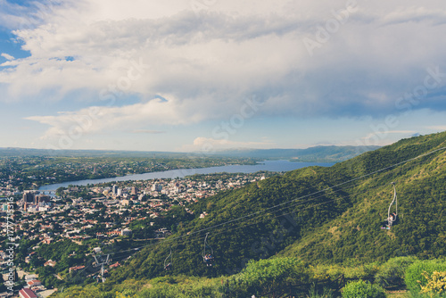 The city stretches between the mountains, combining its natural surroundings with the urban and tourist life typical of the valley.