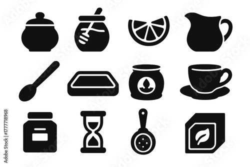 Tea Accessories Icons. Solid style icons of Tea accessories: sugar bowl, honey jar, lemon slice, milk jug, stirring spoon, tea