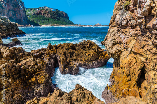 A view of the sea breaking on the rocky shoreline on the West Head headland, South Africa in Springtime