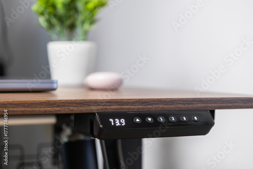 Tableau sur toile Modern electric standing desk control panel displaying 73