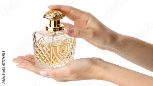Elegant Hand Holding Luxury Perfume Bottle with Golden Cap