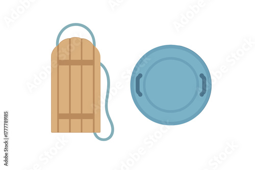 Traditional wooden sled and modern snow saucer for winter recreation activities