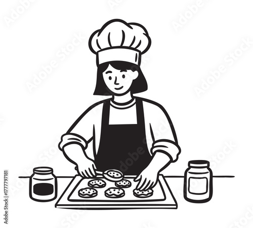 Female chef in a hat and apron preparing cookies on a tray, with jars on either side on a kitchen counter.