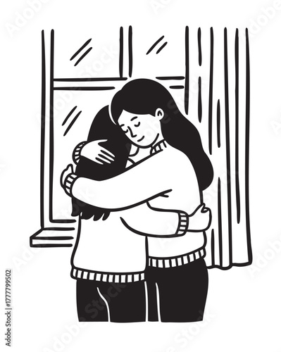 Two young females embracing warmly beside a window, showcasing a tender moment of friendship and support.