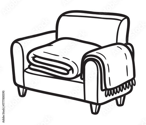 Black outline vector icon of a cozy armchair with a neatly folded blanket on the seat and a fringed throw draped over the armrest.