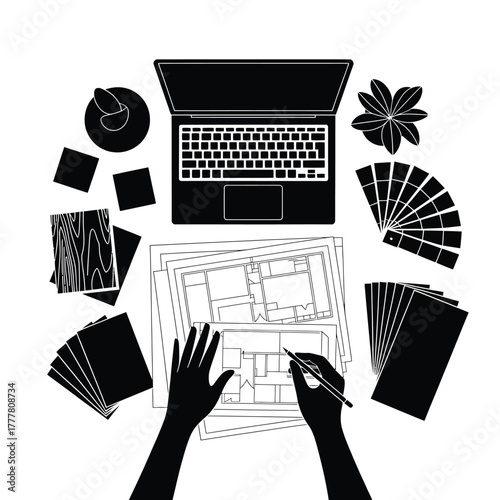 Designer working on architectural plans with laptop and material samples