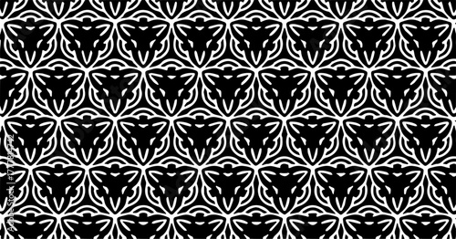 Seamless vector pattern with black and white heart-like ornamental shapes forming a classic romantic design.
