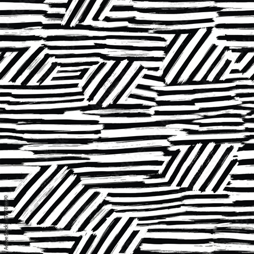 Abstract seamless pattern with hand-drawn black and white brushstroke stripes arranged in various horizontal and diagonal orientations, creating a dynamic visual.