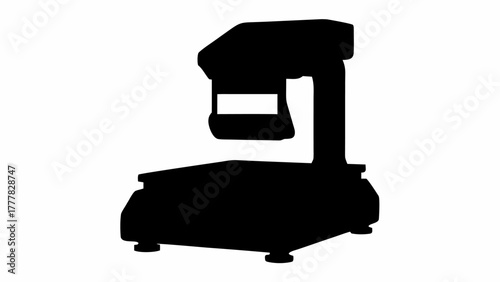 Silhouette of a laboratory balance with a display and a weighing platform on a white backdrop view