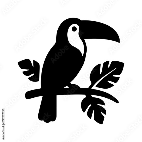 A striking black silhouette of a toucan perched on a branch with tropical leaves perfect for graphic design and nature themes