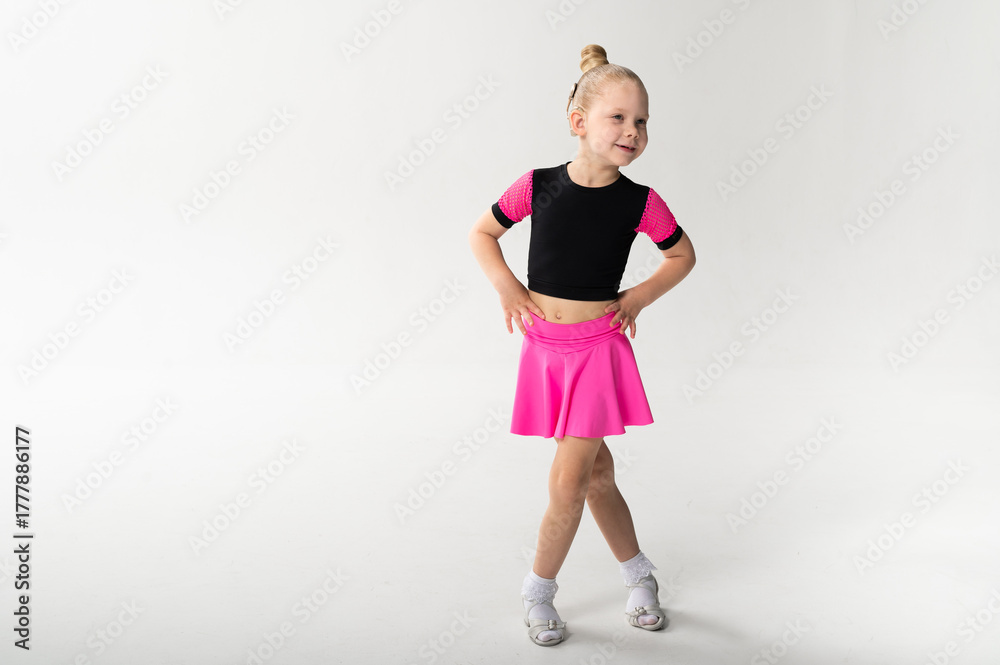 Fototapeta premium Girl with cochlear implant in dance pose, copy space. Symbol of resilience, equality, and artistic courage through sound technology and inclusive childhood art.