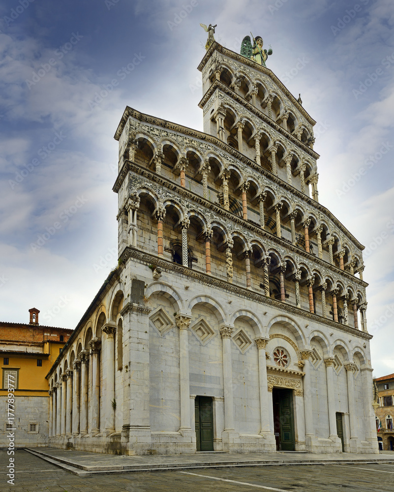 Fototapeta premium Lucca, Italy - Chiesa di San Michele in Foro, St Michael church basilica on Piazza San Michele square in historical centre of old medieval town Lucca, Tuscany, Unesco World Heritage site, Italy