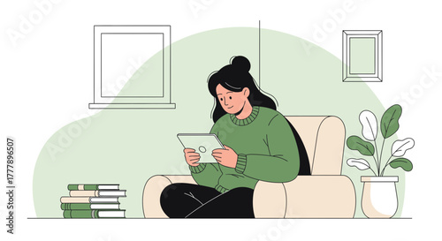 Woman Relaxing On A Sofa Using Her Tablet Enjoying Leisure Time At Home