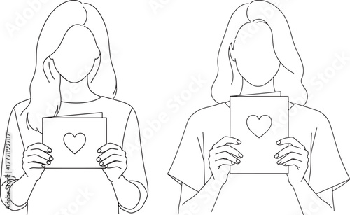 Two people holding valentines cards silhouette
