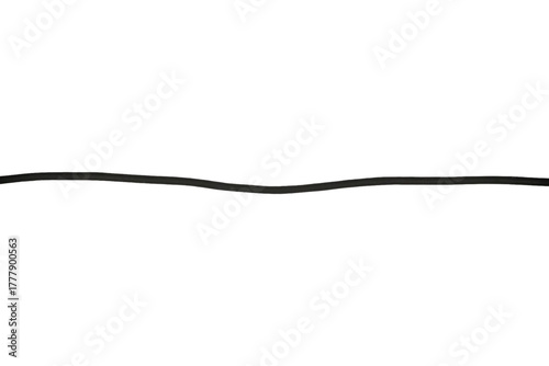 Long black flexible electric wire is isolated.