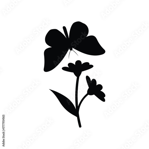 Silhouette of a butterfly above flowers insect animal