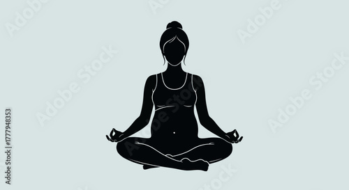 Silhouette of a pregnant woman sitting in a lotus position, meditating with hands in mudra.