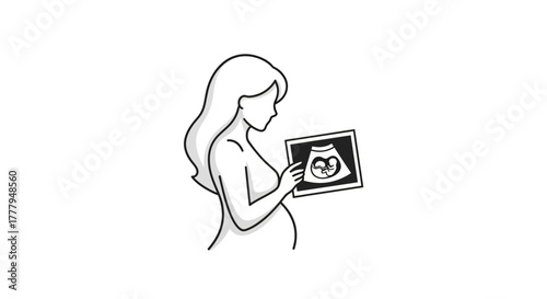 A pregnant woman examines an ultrasound image of her unborn baby, joyful.