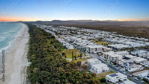 Sunset drone aerial view of beachfront properties at Salt Kingscliff overlooking coastline and ocean
