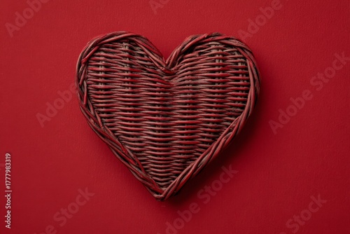 Red Woven Heart on a Vibrant Backdrop for Decorative Purposes and Celebrations