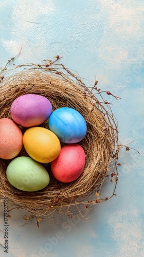 Colorful Eggs in a Woven Nest on a Pastel Background for Spring Celebration