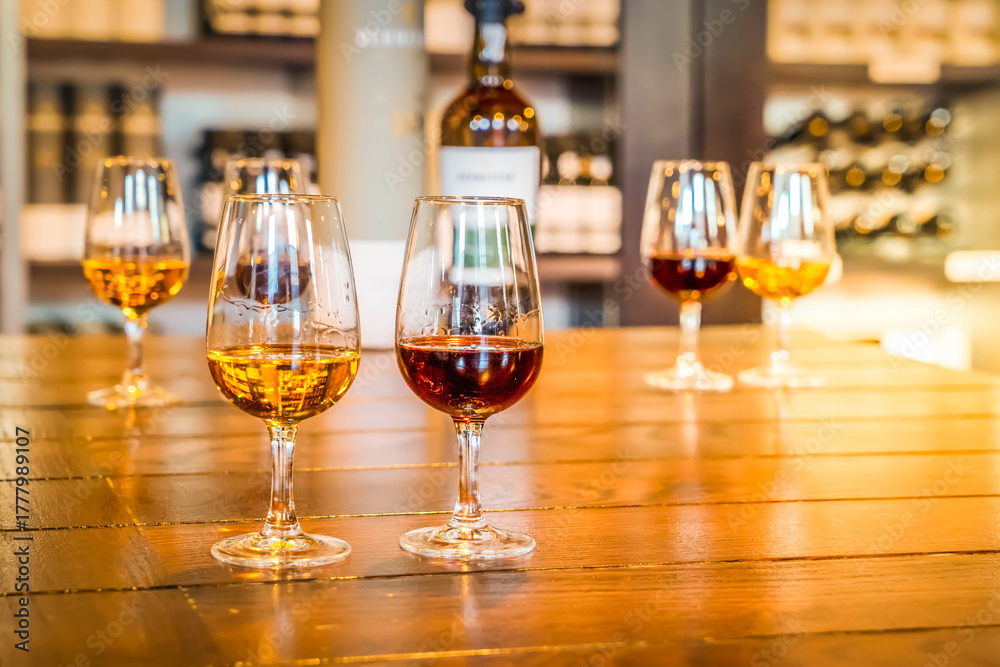 Fototapeta premium port wine testing, glasses with drink samples in bar