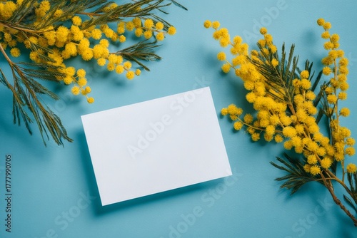 Bright Yellow Flowers Surround a Blank Card on a Blue Background for Creative...