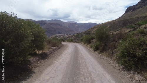 POV aerial drone flight along a mountain road in the Peruvian Andes