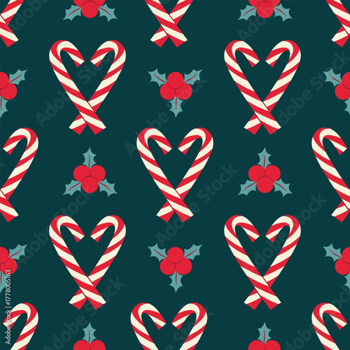 Christmas candy canes seamless pattern on blue. Winter holiday holly berries repeat background.