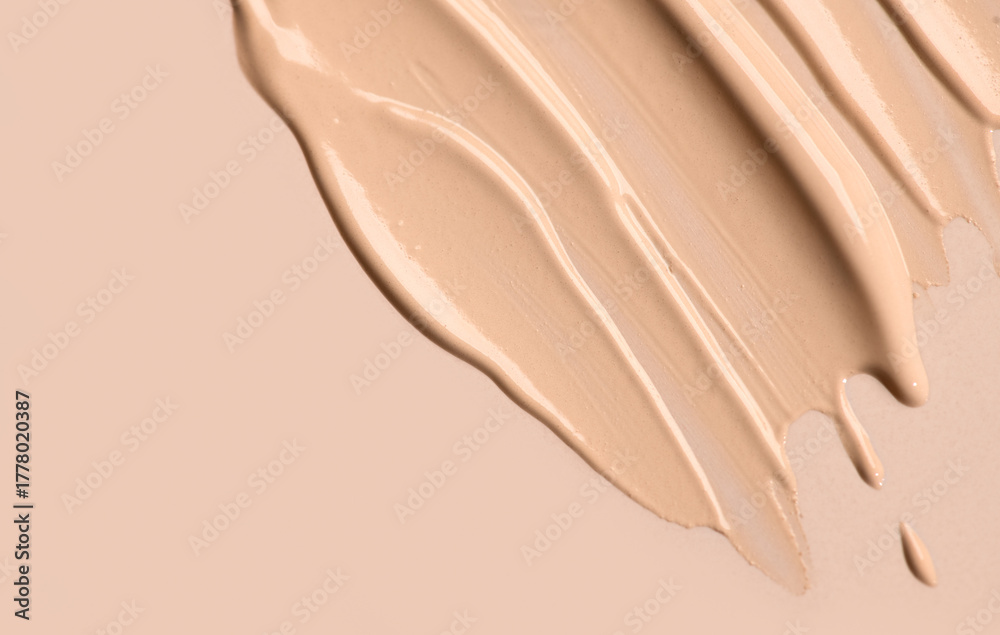 Naklejka premium Foundation, concealer, face makeup smudge, smears border. Cosmetic liquid foundation or cream beige color smudges, stroke. Contouring, Make up background. Foundation texture surface, bb, cc cream