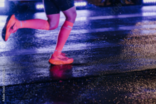 Photography Night marathon runners crowd in the rain, sportsmen participants start running t