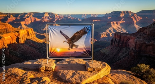 Dramatic Grand Canyon scene with eagle image on screen, capturing majestic landscape with sunlight. This Grand Canyon art blends technology and nature,