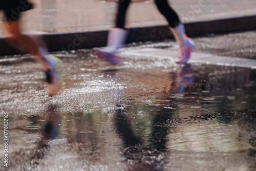 Photography Night marathon runners crowd in the rain, sportsmen participants start running t