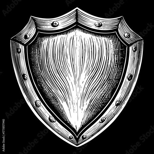 Vintage style engraved heater shield with rivets on black background