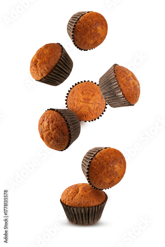  Falling chocolate muffin isolated on white background.