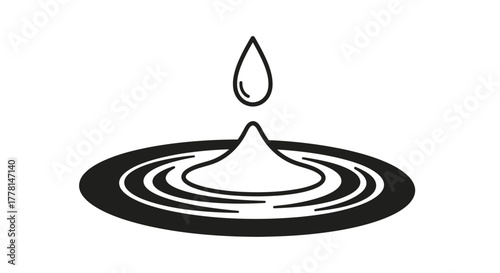 A water droplet falls into ripples on a surface.