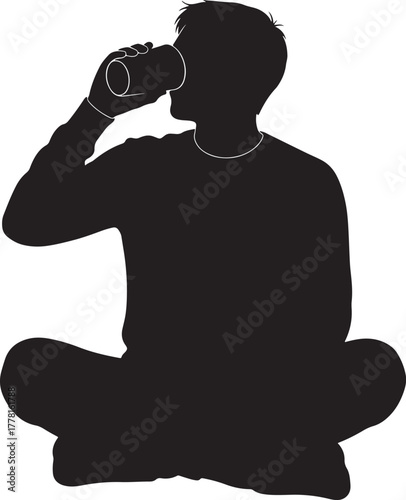 Man sitting cross legged drinking from a mug silhouette