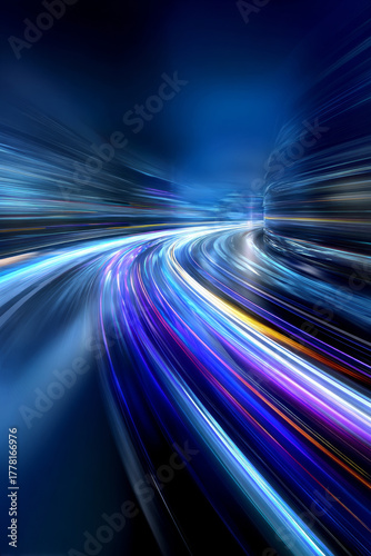 Abstract light trails create a dynamic motion effect on a dark background, showcasing vibrant colors and energy in a modern urban environment, emphasizing speed and movement