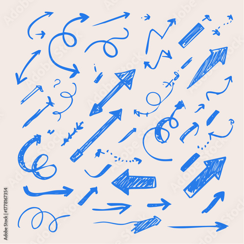 Blue pen arrow collection on checkered paper sheet. Hand drawn crayon various arrows, curved, wavy and straight lines. Direction pointers for notes, doodle and school design. Playful emphasis elements