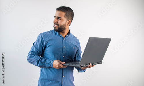 Man Looking Away with Laptop, Thinking and Planning