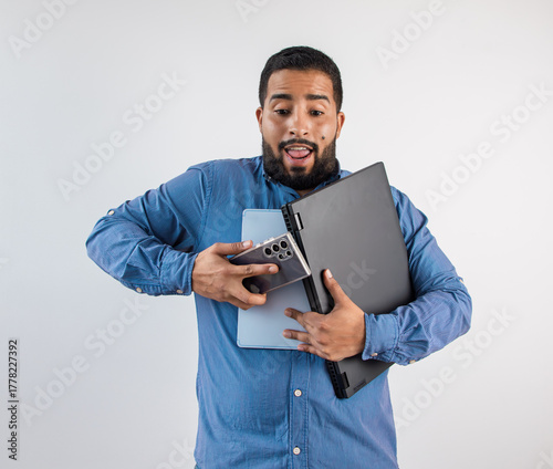 Stressed Man Juggling Devices: Laptop, Tablet, and Phone