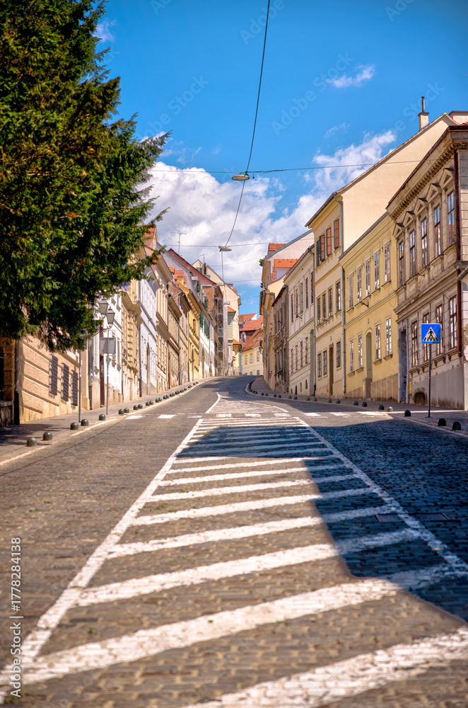 Obraz premium Zagreb, Croatia – July 18, 2025: Historic façades, government buildings, and narrow streets showcase the distinctive architectural character of Zagreb’s Upper and Lower Towns. 
