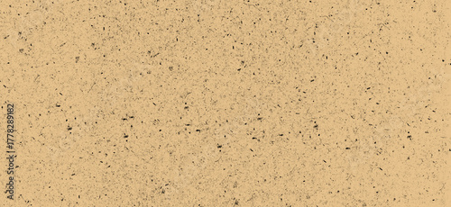 Beige background with small dark spots creating a textured surface, ideal for use as a subtle backdrop or overlay in graphic design and photography projects