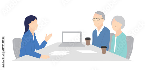 窓口でお客様の接客をするビジネスパーソン