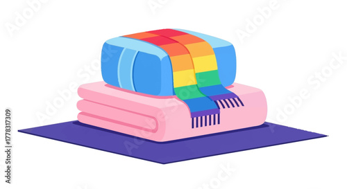 Stacked towels on a purple mat with a comb