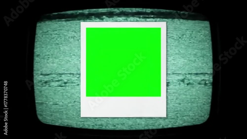 Keyable Graphic Element with the retro vintage green frame of an old white instant photo over a bad tv vhs texture background scanlines distortion, screen overlay, glitch, static noise, scan lines on