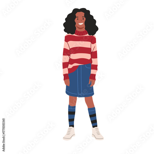 Smiling girl with curly hair wearing red striped sweater, denim skirt, long socks, and white sneakers. Cute child character illustration, isolated on white background, flat vector art style.