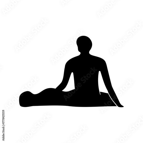 Silhouette of person seated with arms outstretched in meditative or contemplative pose
